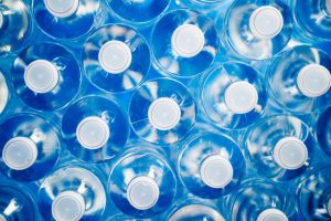 What raw materials are used to make plastic water bottles